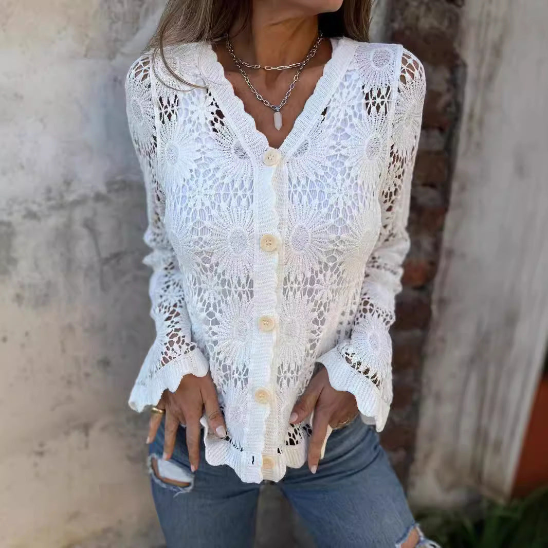 Woman wearing a white crochet cardigan with a rustic background