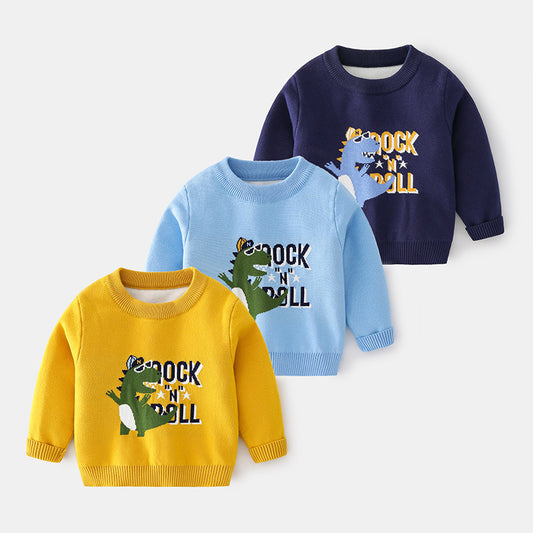 Three children's sweaters in yellow, blue, and navy with dinosaur graphics on a white background.