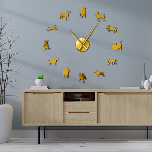 Gold dog-shaped clock on a gray wall with a wooden cabinet below.