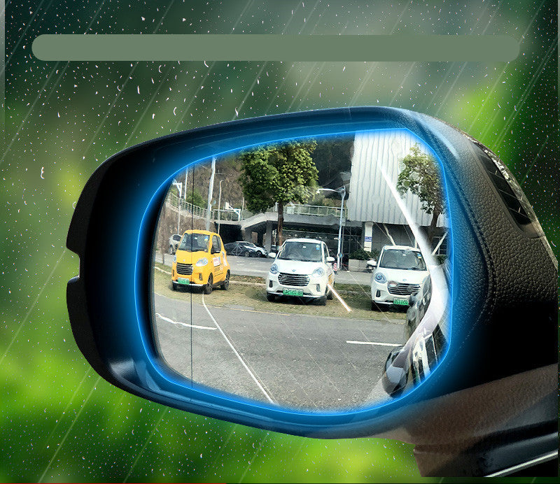 Car side mirror with water-resistant film on a green background
