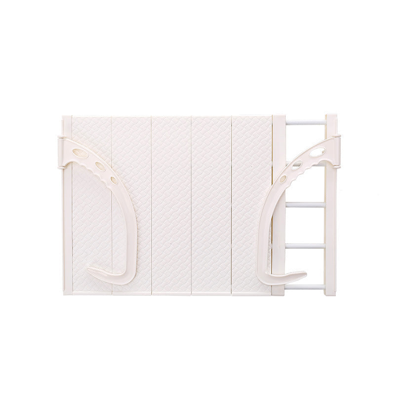 White baby gate with dimensions on a white background