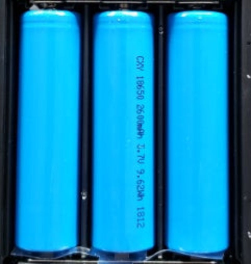 Three blue cylindrical batteries with text on a black background