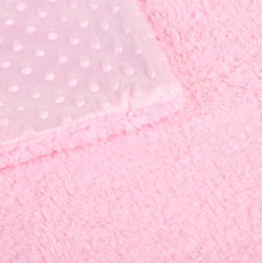 Close-up of pink fabric with a subtle pattern