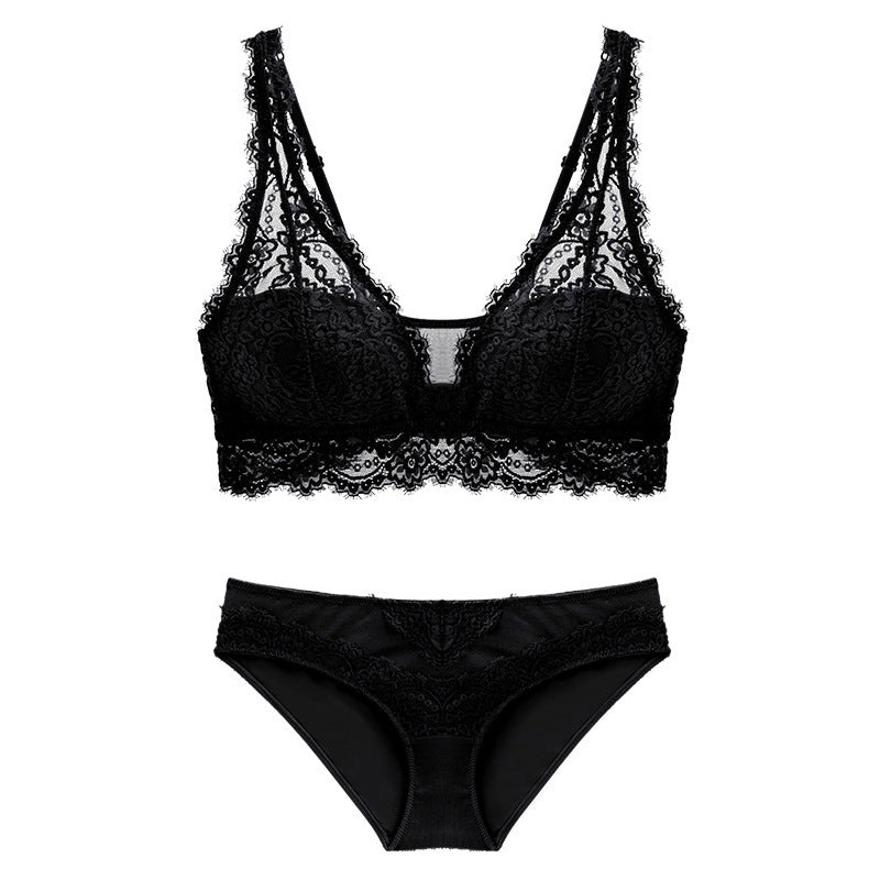 Black lace bra and panties set on a white background