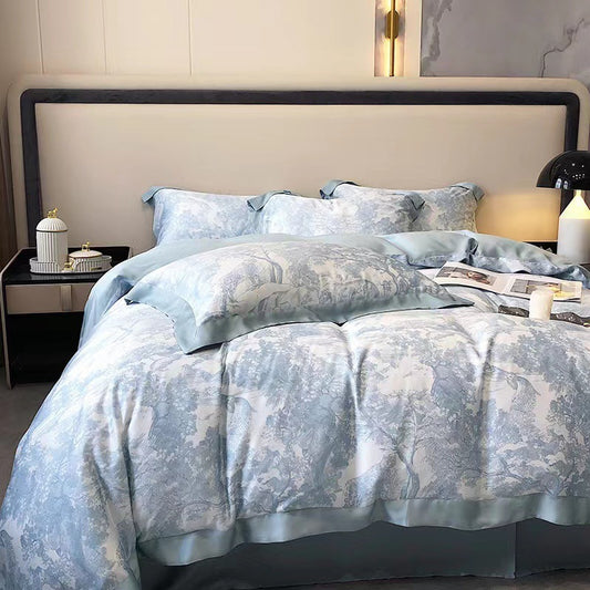 Neatly made bed with light blue floral-patterned bedding in a bedroom setting.