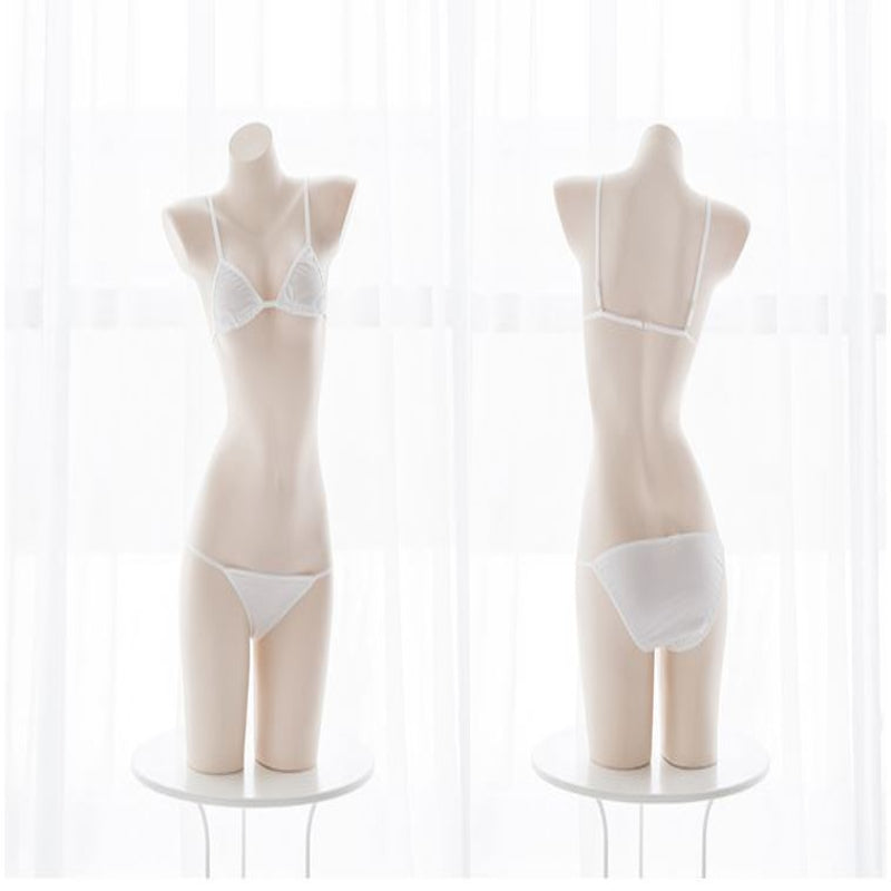 Two mannequins wearing white lingerie on a white background