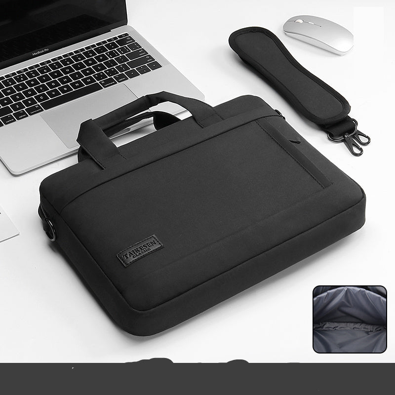Black laptop bag with a handle and zipper closure, displayed next to a laptop and a mouse, with an inset showing the interior of the bag.