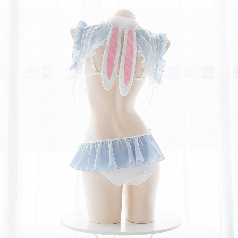 Mannequin wearing a pastel-colored bunny costume with transparent wings on a white background