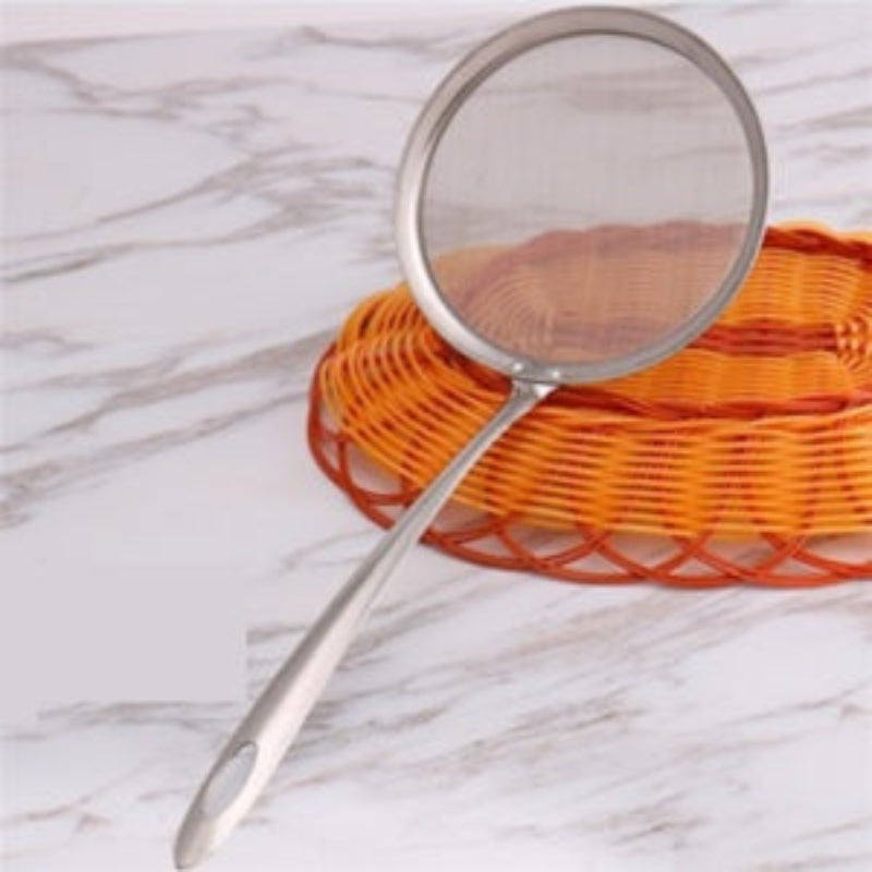 Three stainless steel kitchen oil filters in blue, silver, and pink colors, with lids and handles, displayed on a table.