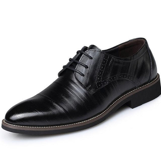 A brown leather dress shoe with a lace-up closure and a rubber sole.