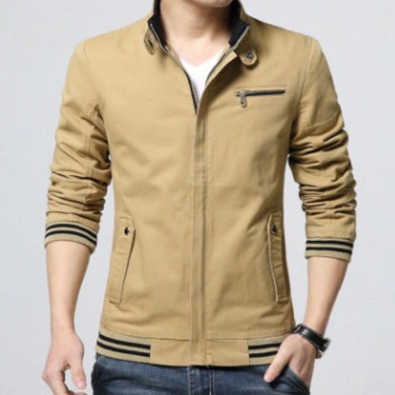 Beige jacket with striped cuffs and hem on a plain background
