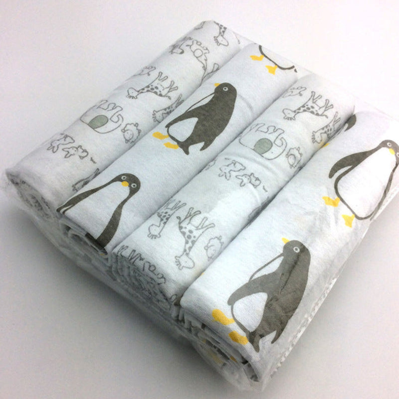 Three rolls of fabric with penguin pattern on a white background