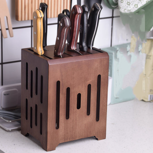 Knife block with knives on a kitchen counter.