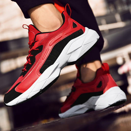 Red and black sneakers with white soles on a blurred background