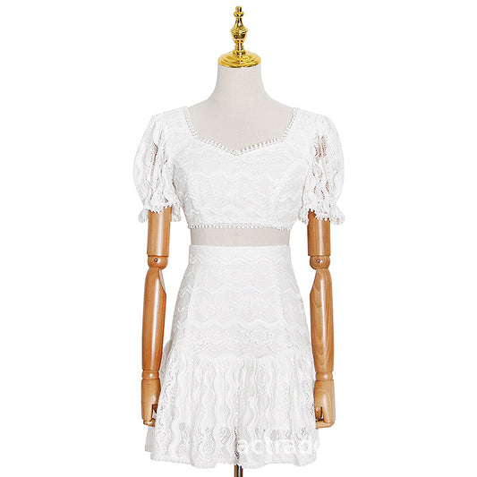 White lace dress on a mannequin against a white background