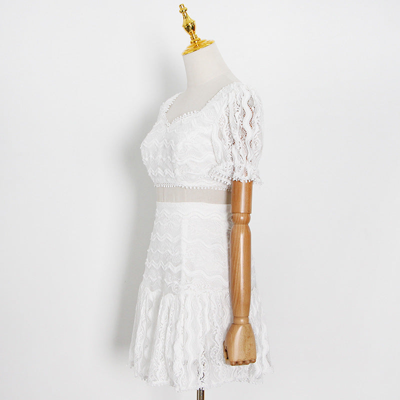 White lace dress on a mannequin against a white background