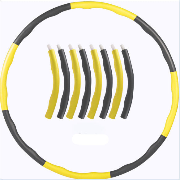 Yellow and black hula hoop with components on a white background