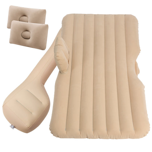 Beige inflatable seat and two travel pillows on a white background