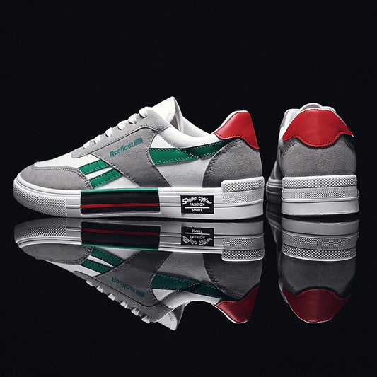Gray sneakers with red and green accents on a black background