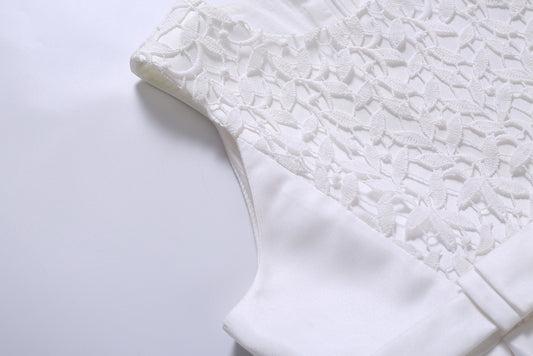 Close-up of a textured white fabric on a light gray background