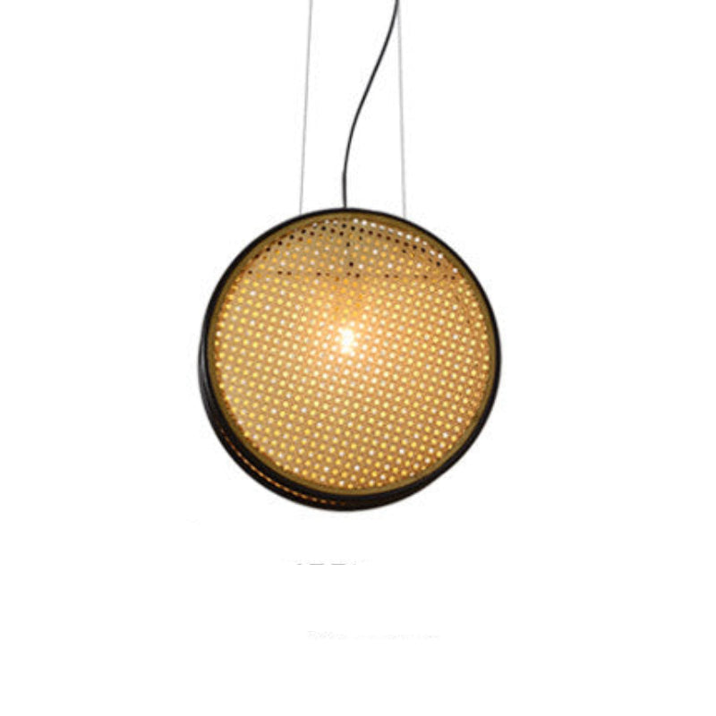 Three black-rimmed rattan chandeliers hanging from the ceiling, intended to provide lighting for a restaurant setting.