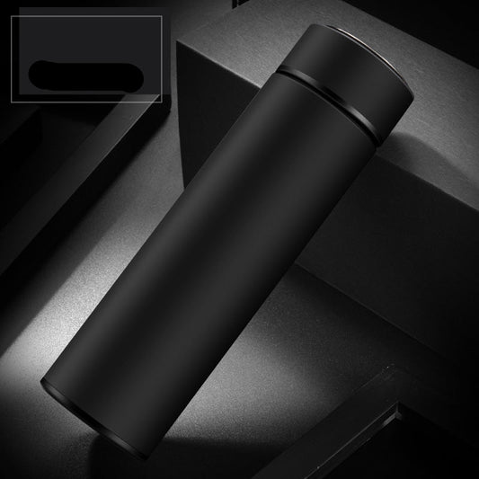 Four stainless steel water bottles in black, red, gold, and blue colors, displayed on a dark surface.