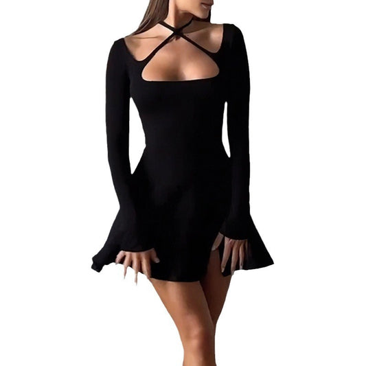 Black dress with long sleeves and cut-out design on a white background