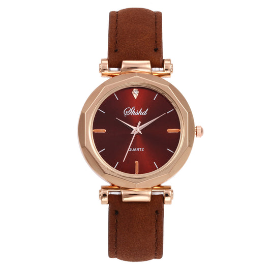 Wristwatch with brown leather strap and red dial on a white background