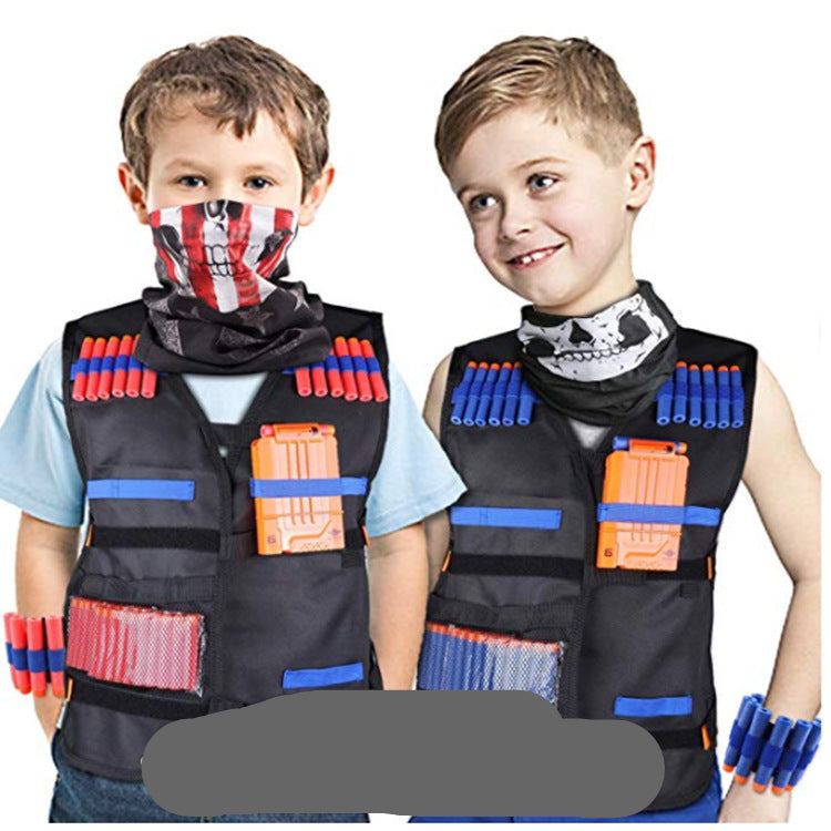 Two children wearing black vests with toy guns and accessories on a white background.