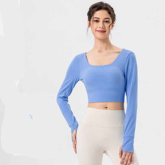 Woman wearing a blue long-sleeve top with fabric texture and color options displayed.
