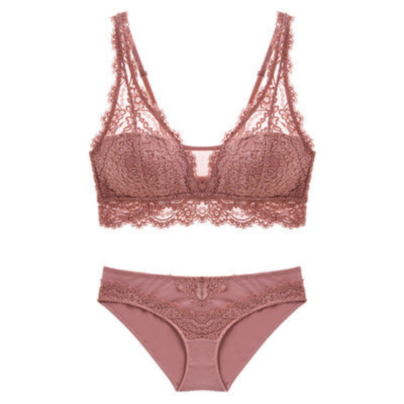 Pink lace bra and panties set on a white background