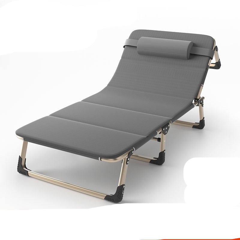 Gray folding bed with adjustable headrest on a white background