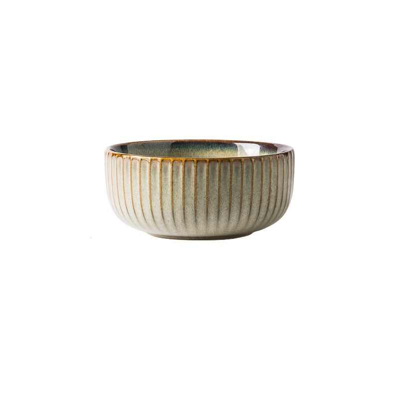 A set of brown ceramic tableware including different sizes of plates and bowls, displayed against a neutral background.