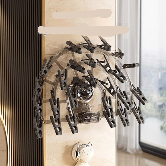 Wall-mounted hair dryer holder with multiple clips on a wall.