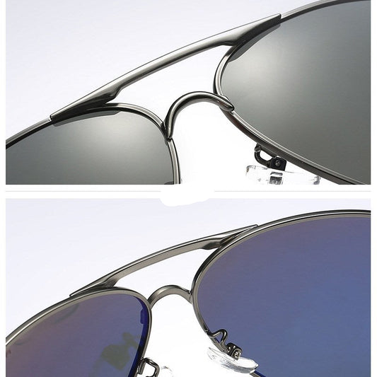Close-up of silver-framed sunglasses with reflective lenses on a white background.