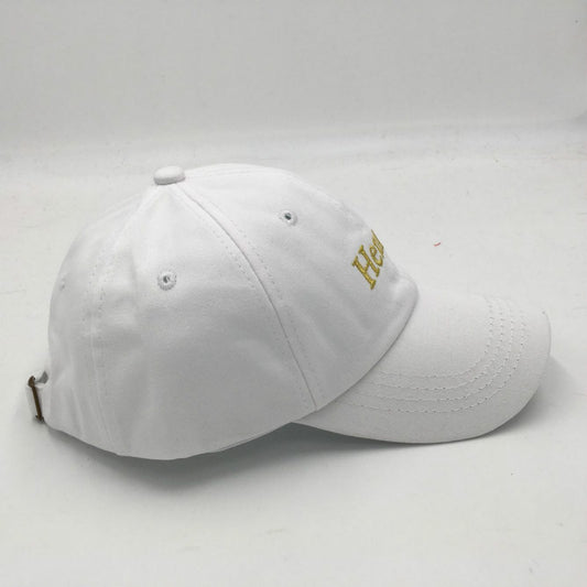 White cap with gold logo on a white background
