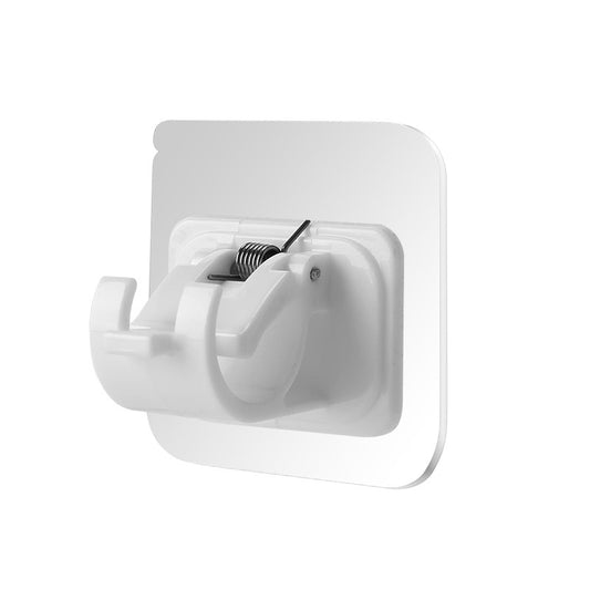 White wall hook with a spring mechanism on a white background
