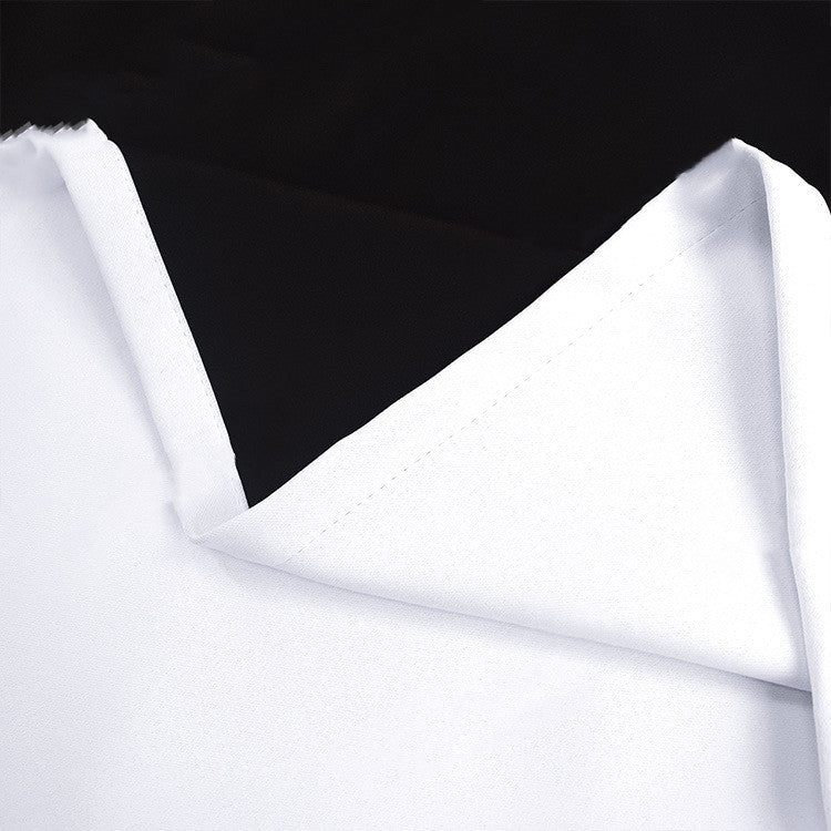 A pair of beige full blackout curtains with black lining, displayed in a room setting, showcasing both sides of the curtains with a visible window in the background.