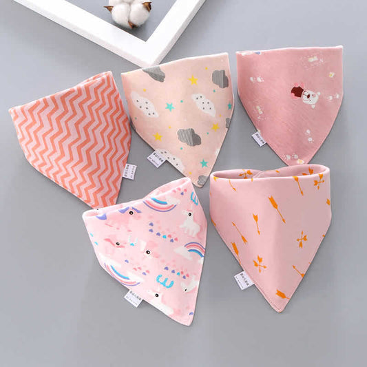 Five pink baby bibs with various patterns on a gray background