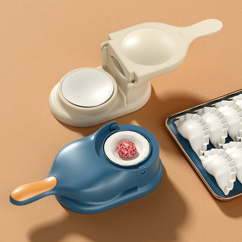 Two dumpling makers on a beige background with a tray of made dumplings.