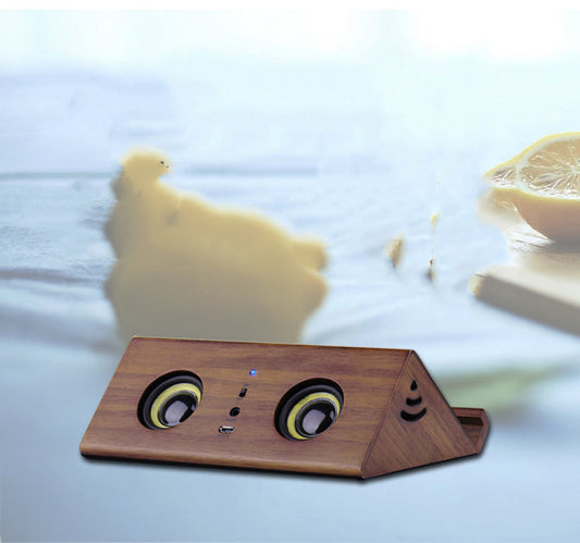 Wooden speaker with lemon and bear in the background