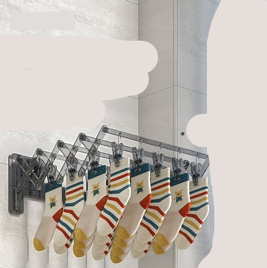 Wall-mounted drying rack with socks hanging on it, against a tiled wall with a window showing blue sky.