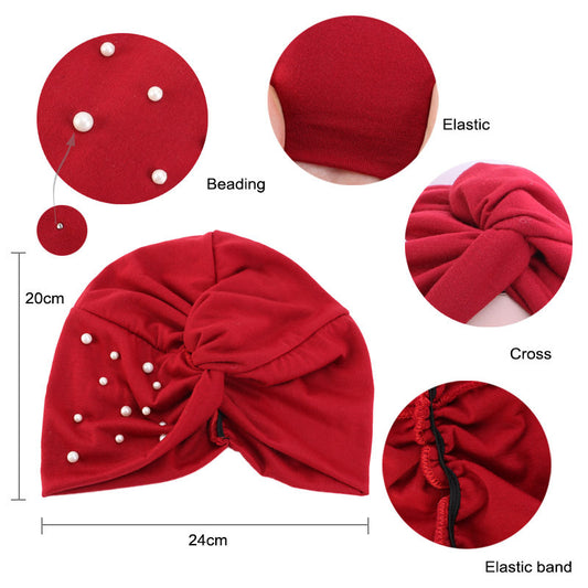 Red baby turban with beading details and measurements.
