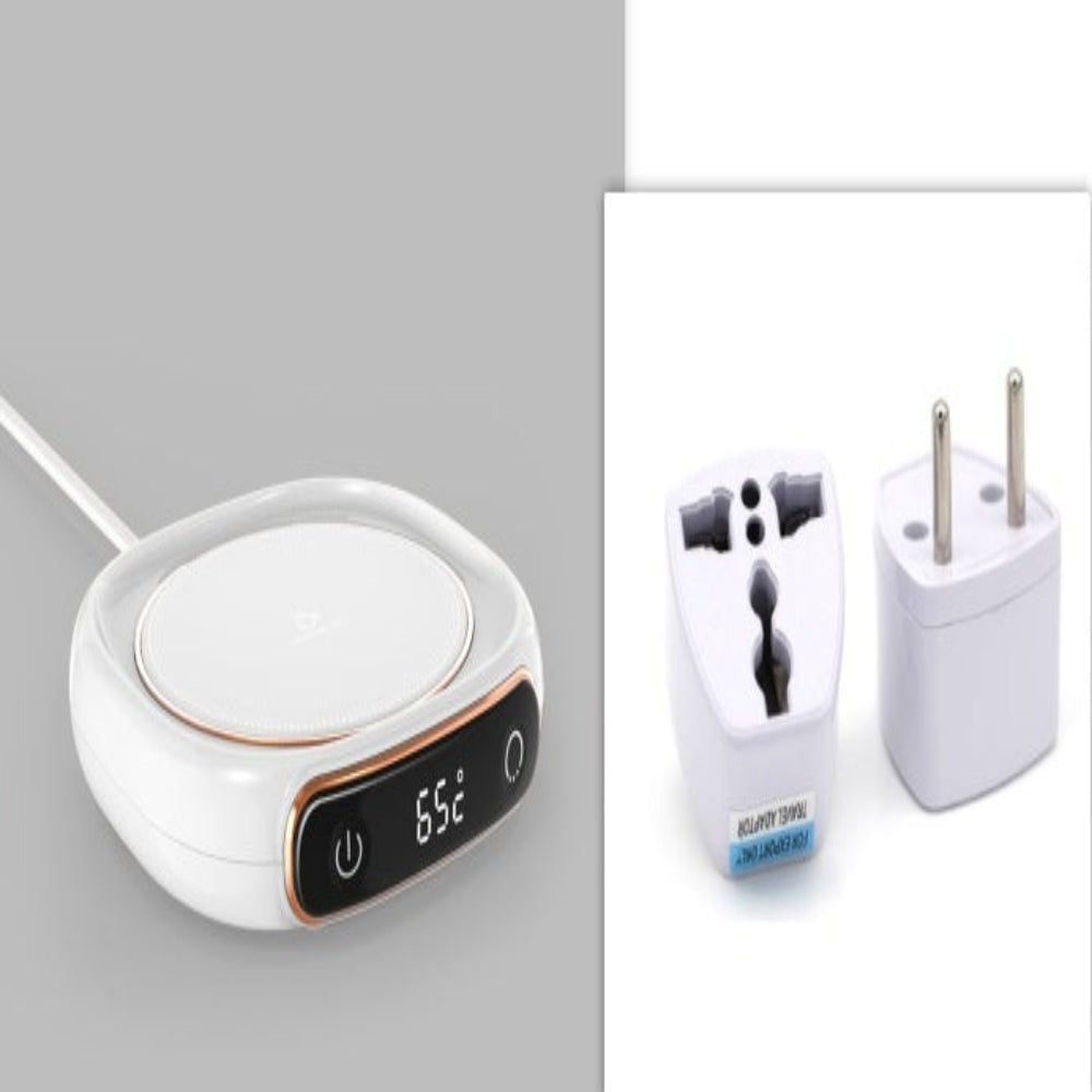 A coffee mug warmer with a digital display showing the temperature, a feature of a smart heating pad, with a mug placed on top and a steering wheel-like control mechanism, all in a pink color.