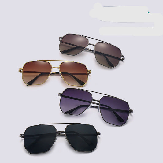 Four pairs of sunglasses with different lens colors on a light gray background.