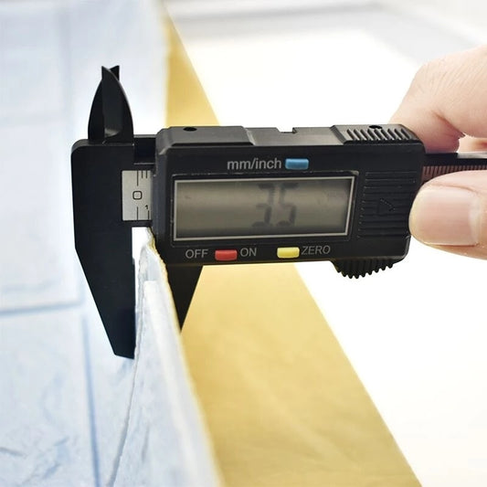 Digital caliper measuring a piece of wood with a blurred background