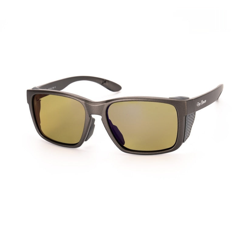 Sunglasses with yellow-green lenses on a white background