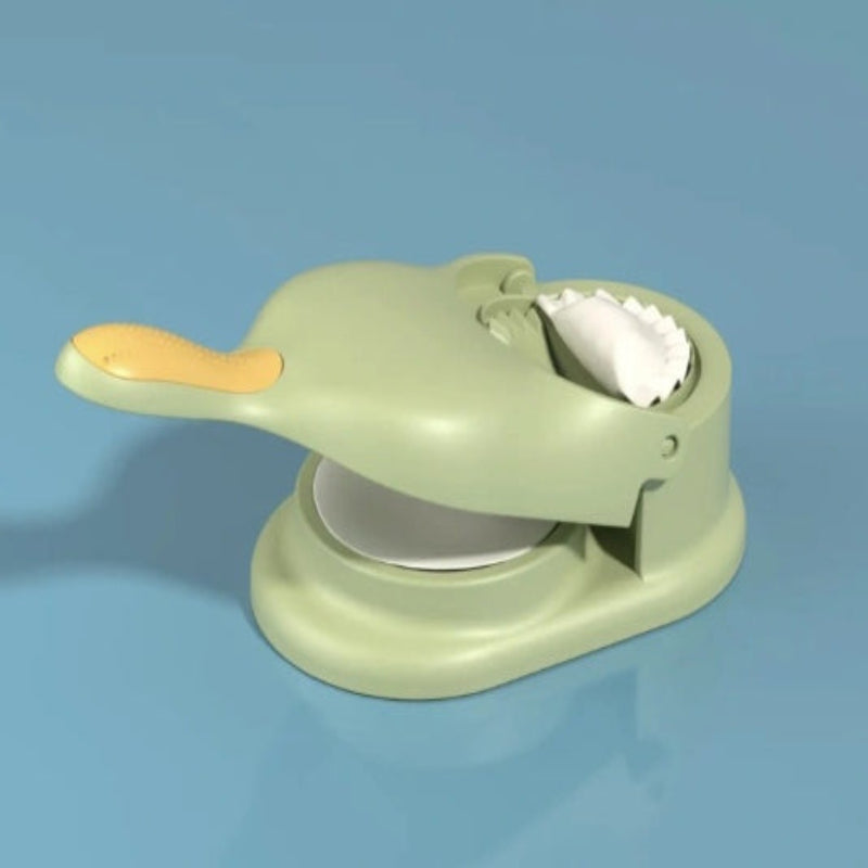 Green duck-shaped object with a white interior on a blue background