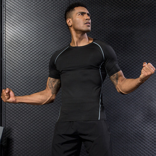Man in black athletic wear flexing muscles against a textured dark background