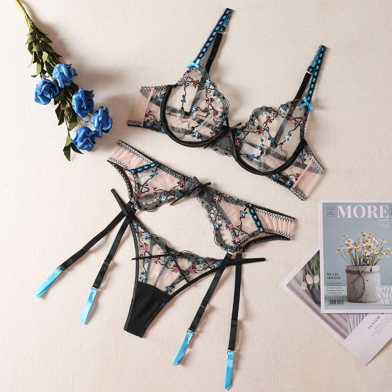 Set of floral lingerie with black straps on a light background